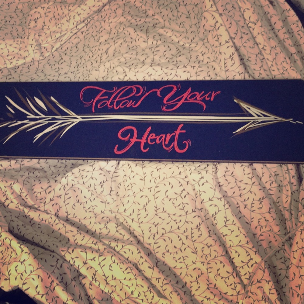 A “follow your heart” sign.